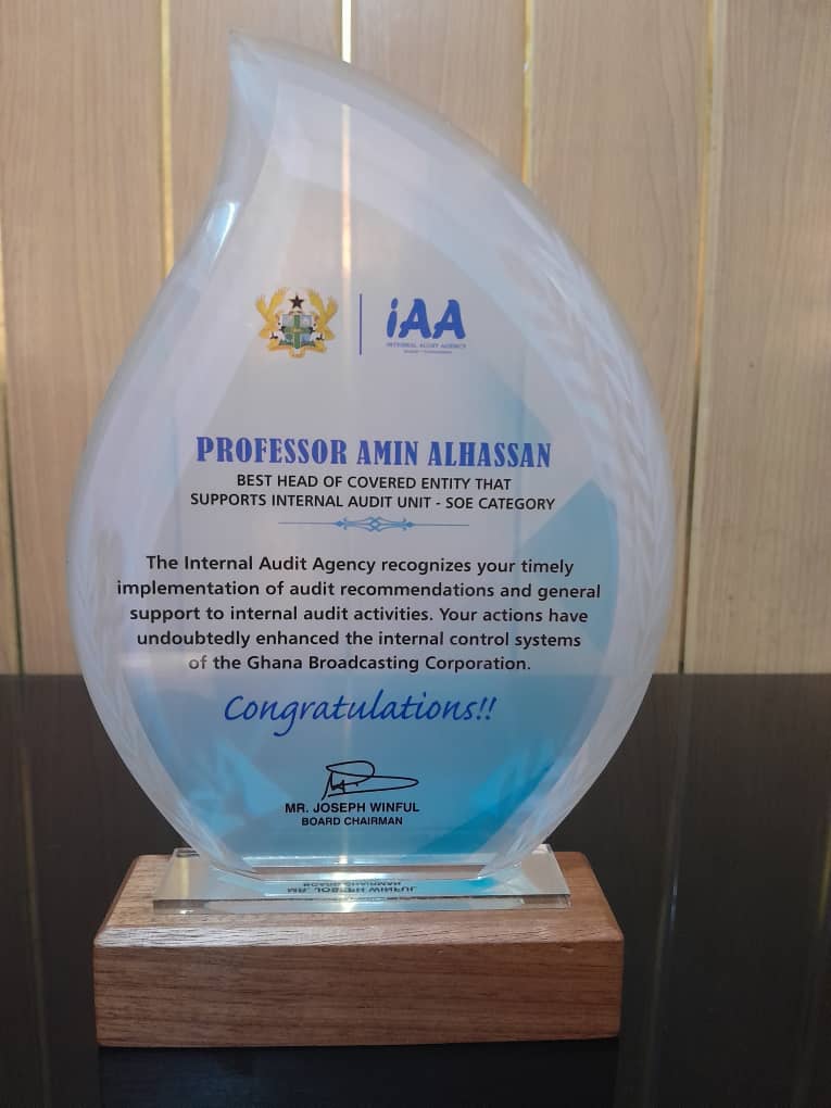 Ghana Broadcasting Corporation Prof. Amin Alhassan proudly displaying the plaque received for Best Head of Covered Entity Award at the 2023 Annual Internal Audit Conference.